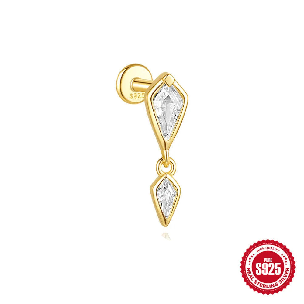 Geometric kite-shaped sterling silver earring with rhinestone head and gold chain tassel.