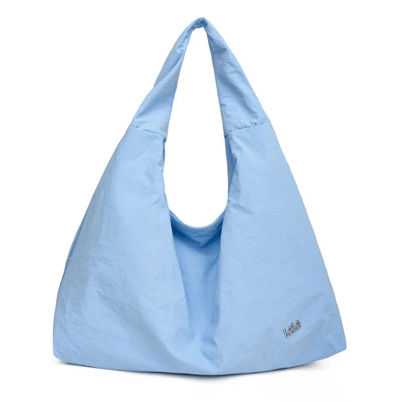 Soft nylon women's underarm bag in a heart shape, shown in black, blue, khaki, and yellow colour options.