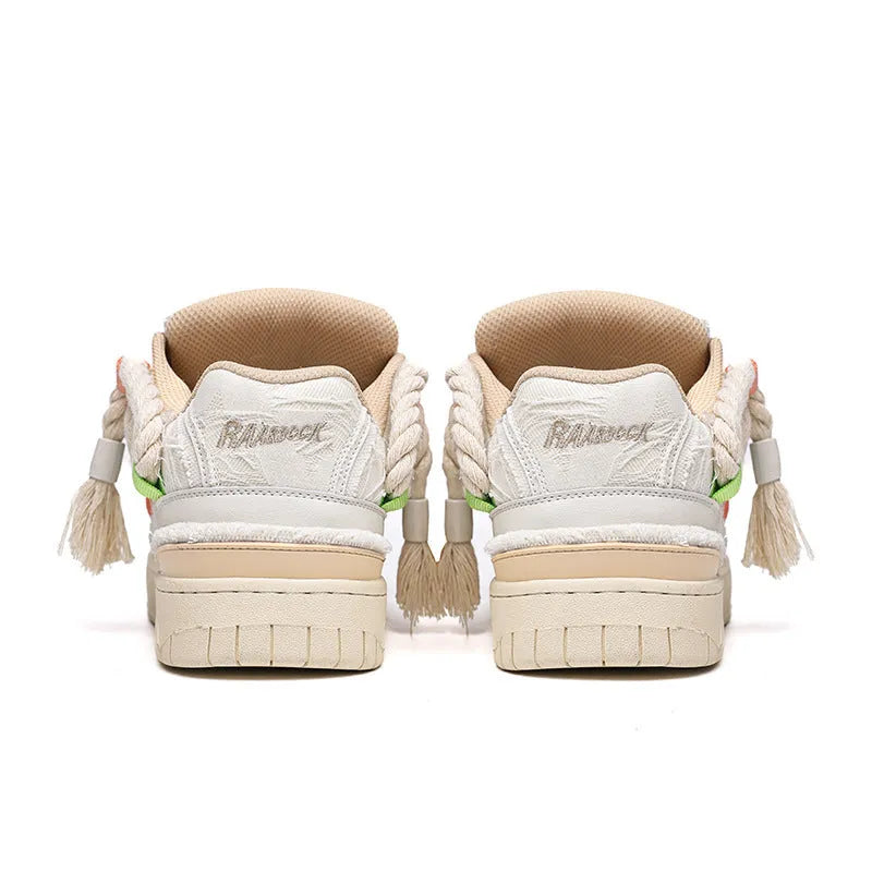 Old Damage creamy white retro low-top skate shoes with lace-up front and platform sole.