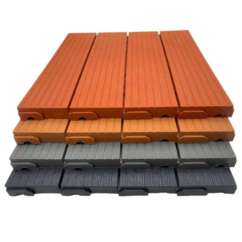 Wood grain plastic floor tiles in brown, grey and orange colours showing non-slip texture