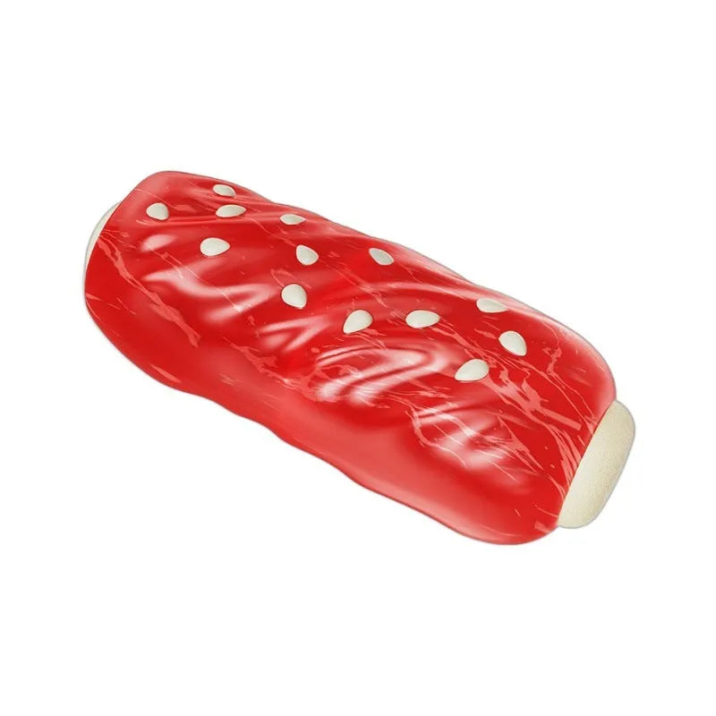Primary colour plastic molar-shaped dog chew toy with textured ridges and hollow treat-dispensing centre