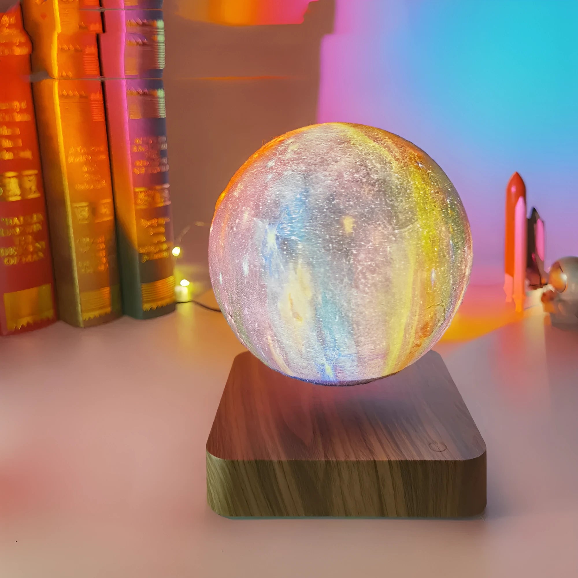 Square walnut coloured magnetic levitation galaxy moon lamp floating above its base