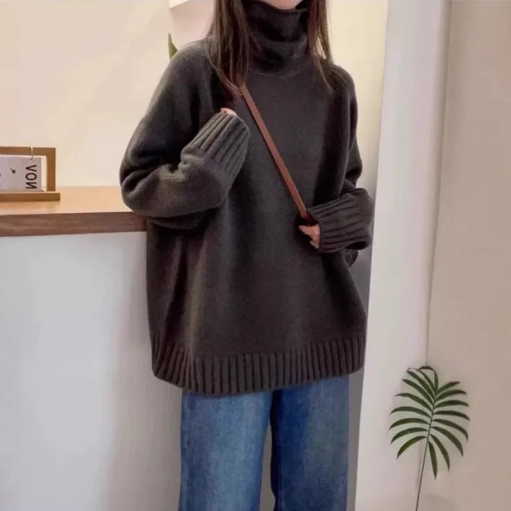 Red loose-fit women's turtleneck sweater with thick knit and a textured curling collar.