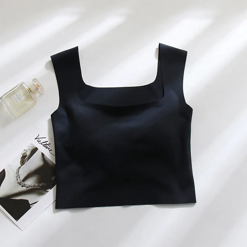 Women's white seamless sling vest with built-in fixation cup and chest pad, shown from the back.