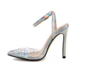 Women's clear PVC pointed toe sandals with a stiletto heel on a white background.