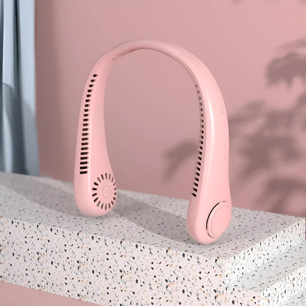 Pink bladeless neck fan being worn, showing soft neckband and compact fan unit.