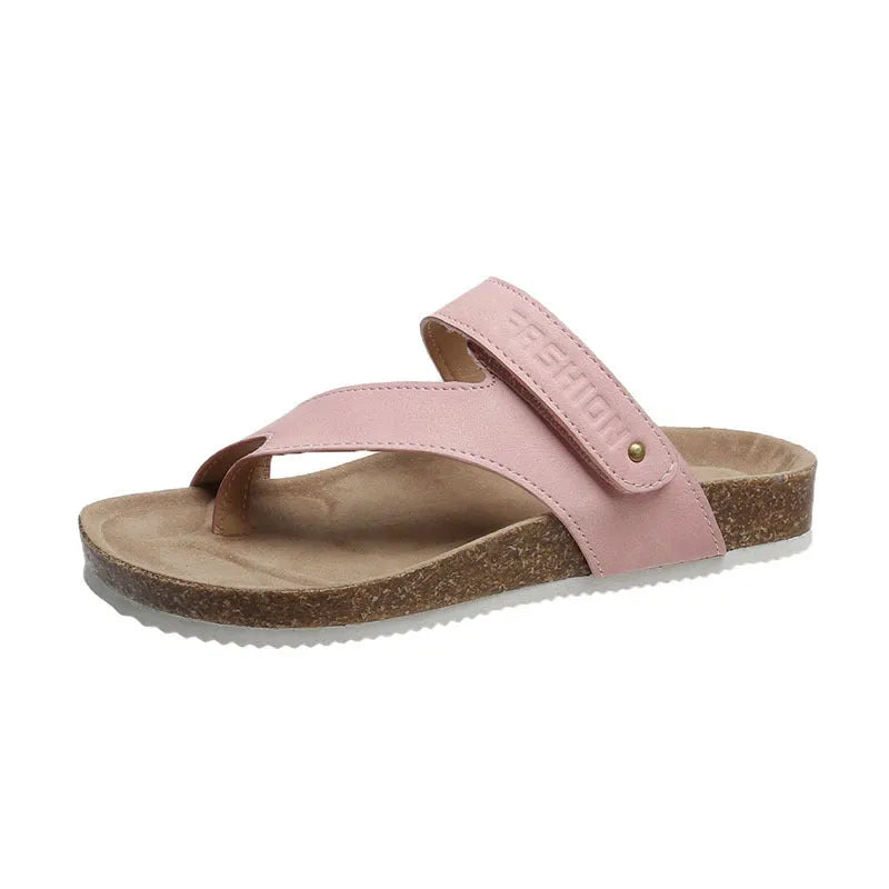 A pair of flat toe ring thick-soled flip-flops in a solid colour on a plain background.