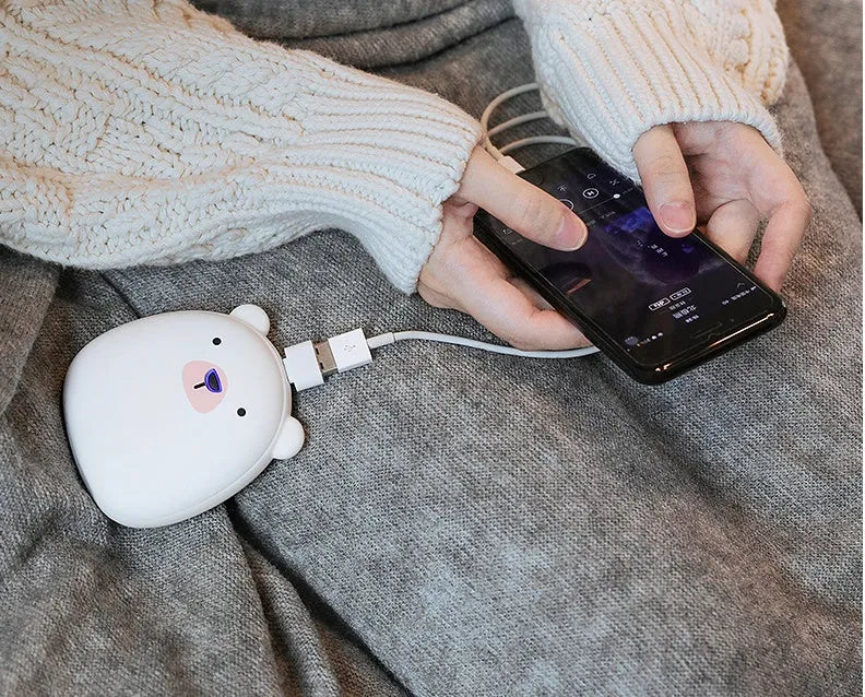 Cartoon penguin polar bear USB rechargeable hand warmer power bank showing black, white, and black-white colour options
