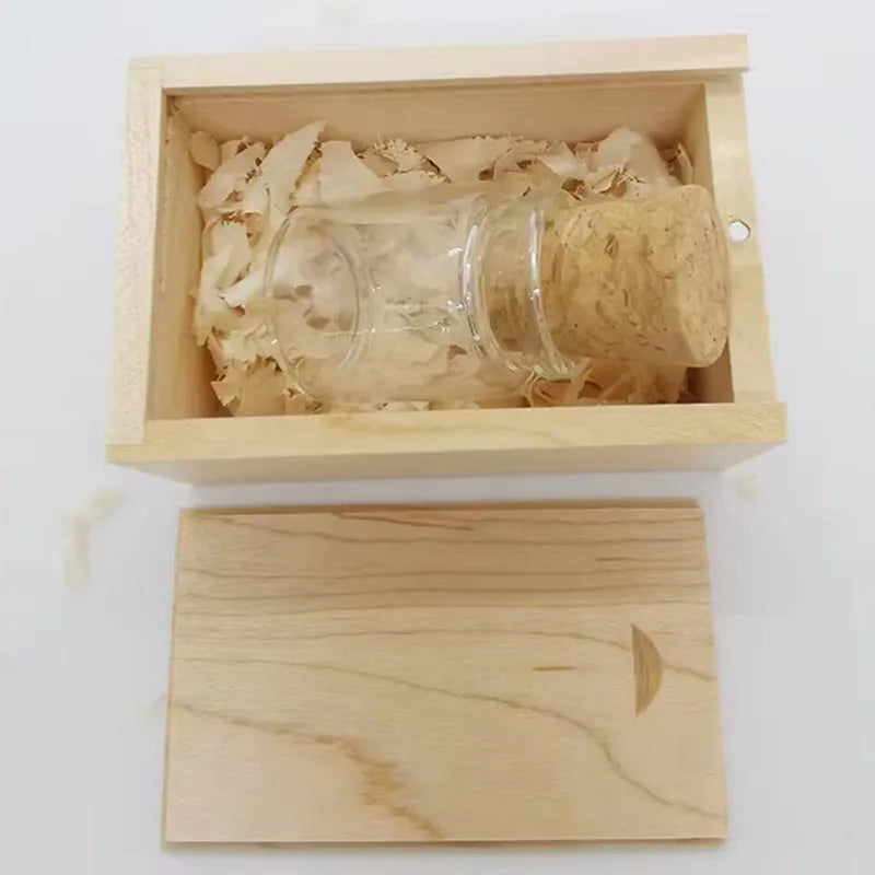 Clear glass bottle USB flash drive with wooden cap showing internal component