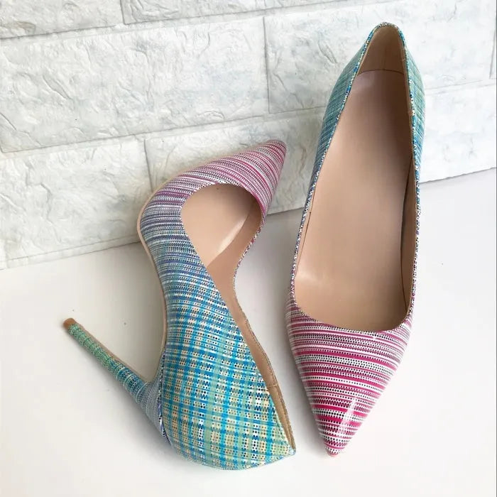 Ladies pointed toe patent leather heels with a pink to blue gradient colour and a high thin heel.