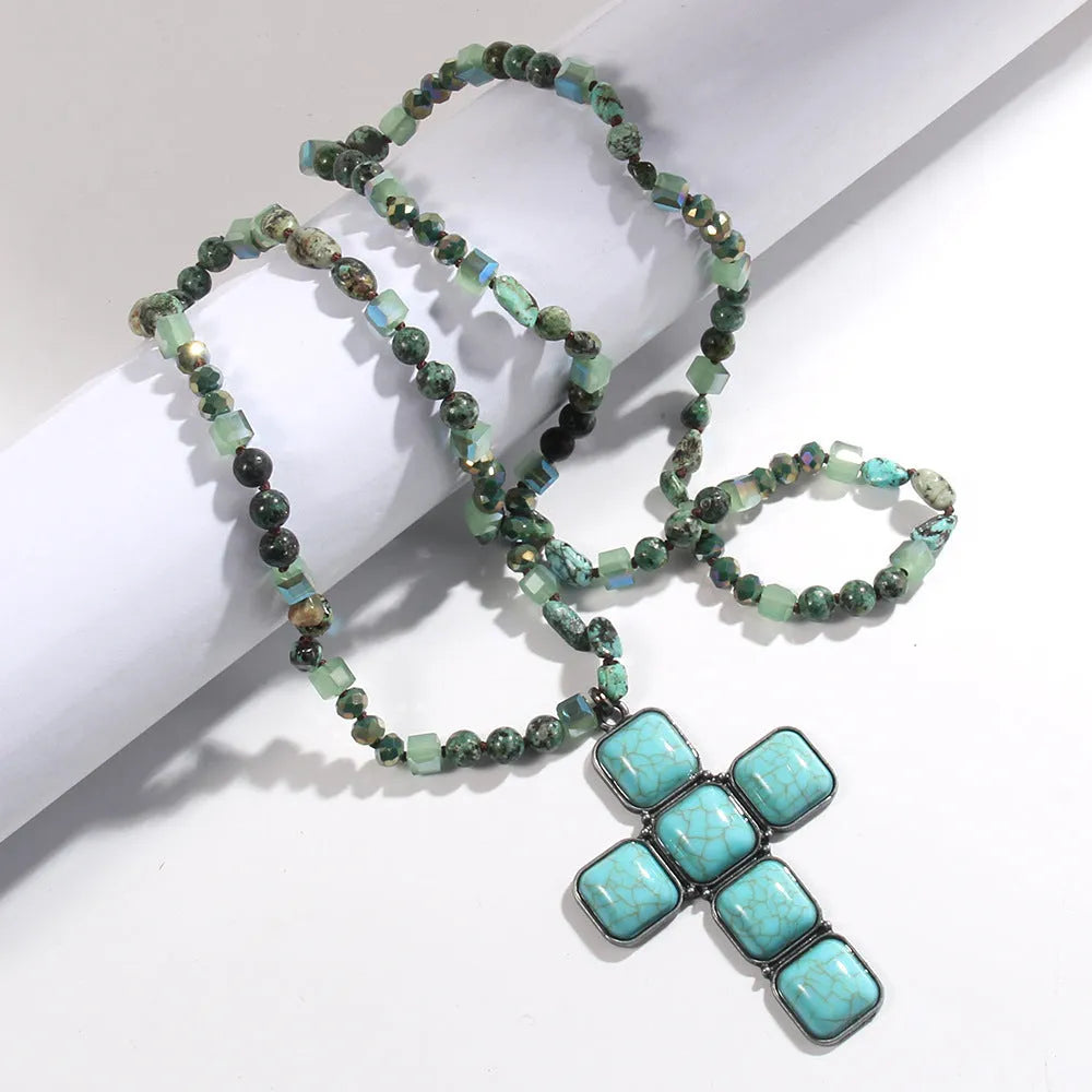 Glass and stone square cross pendant necklace with knotted chain in blue, 81cm long