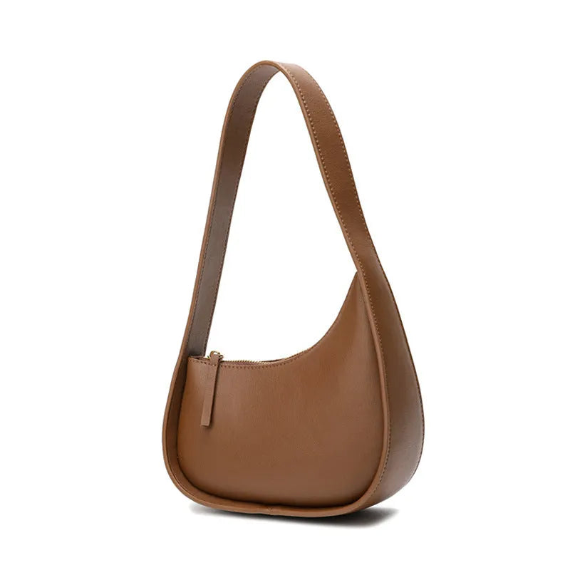 Small half moon shaped leather shoulder bag with wide strap in four colour options