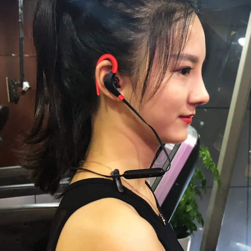 Bluetooth earphone 5.0 wireless stereo earbuds in black, red, and white with charging cable
