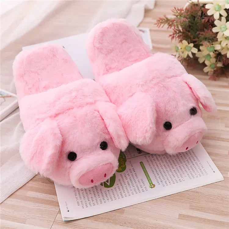 Pink pig design floor slippers with plush lining shown from side view