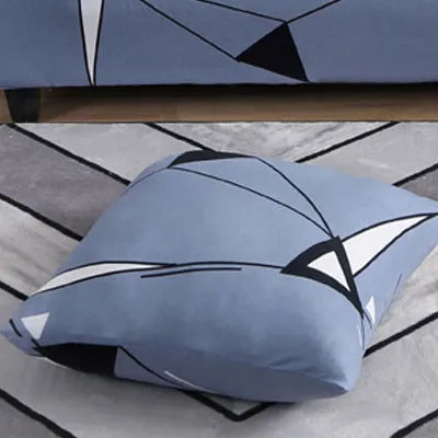 Geometric print polyester sofa slipcover stretched over sofa with matching pillowcase