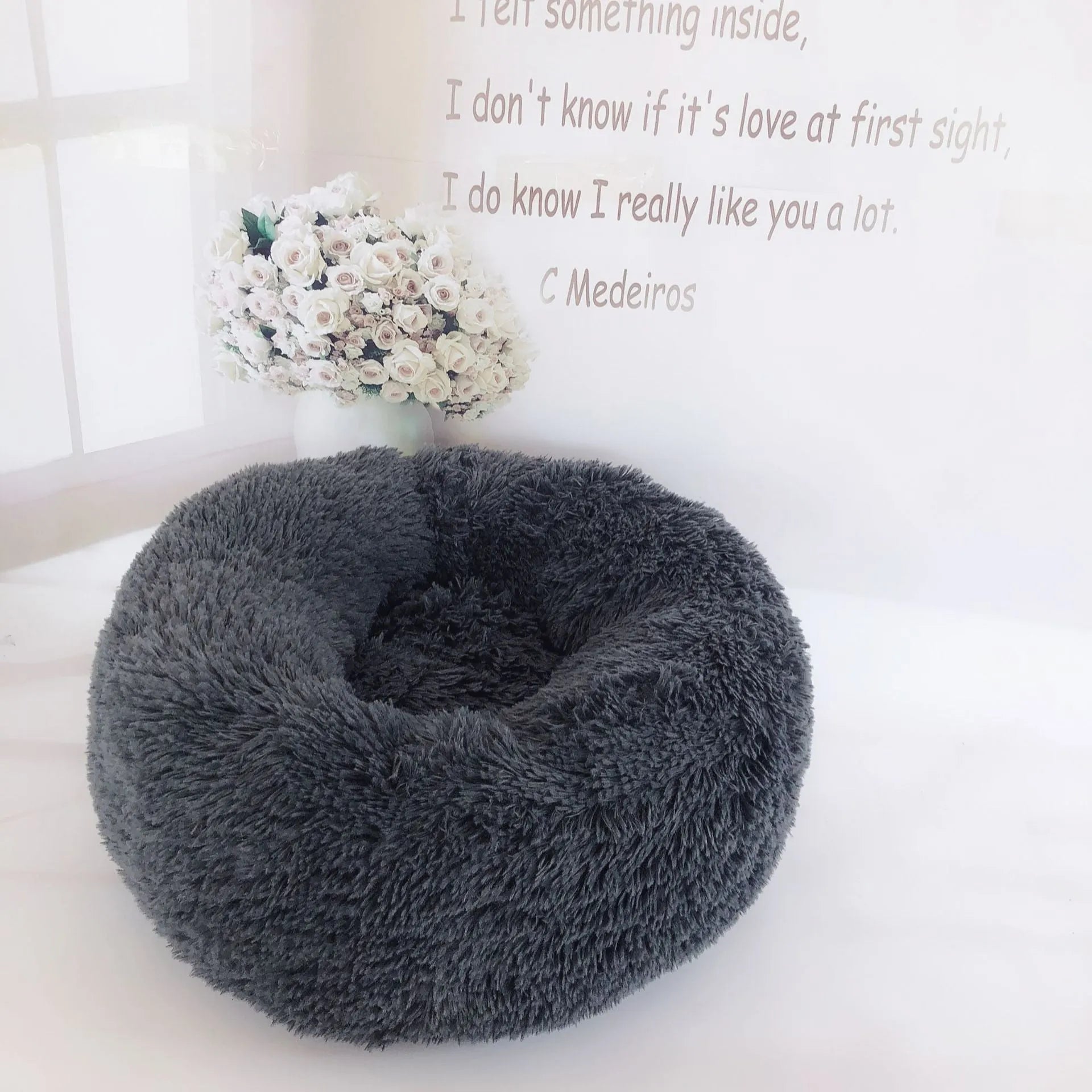 Plush pet nest in apricot colour on floor, soft cloth circular dog bed 40cm diameter indoor use