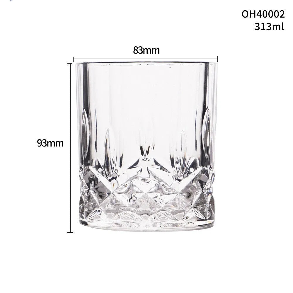 Clear thick-bottom whiskey shot glass with 301-400ml capacity on a table.