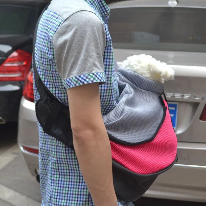 Blue pet carrier backpack for small dogs or cats with mesh window and adjustable straps