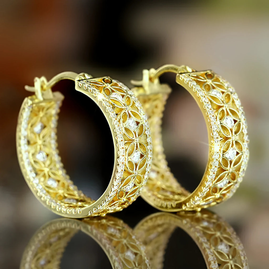 Pair of yellow gold coloured copper ear clips with a geometric horse eye flower butterfly design.