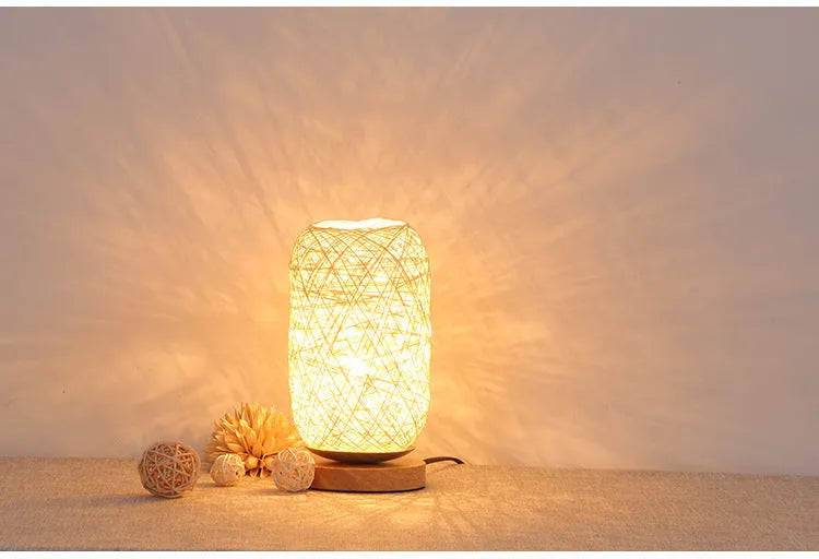Brown hemp rope Sepak Takraw ball desk lamp on a wooden base with USB cable.