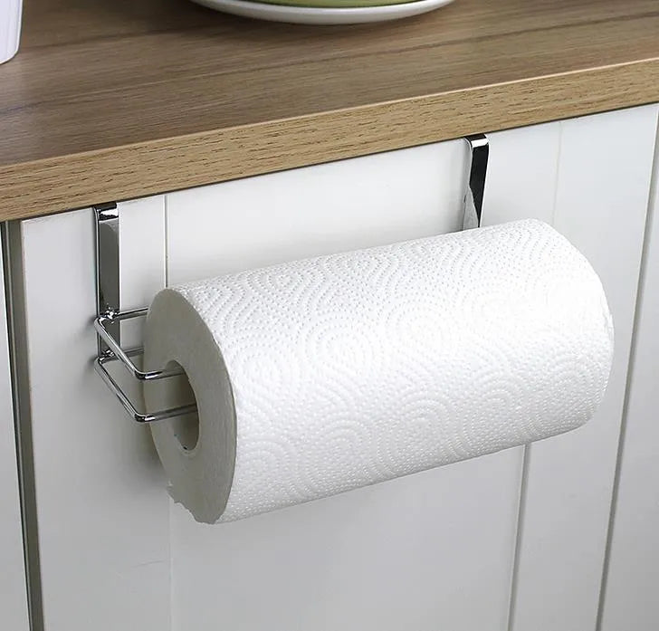 Silver stainless steel paper towel rack mounted on kitchen cabinet door back