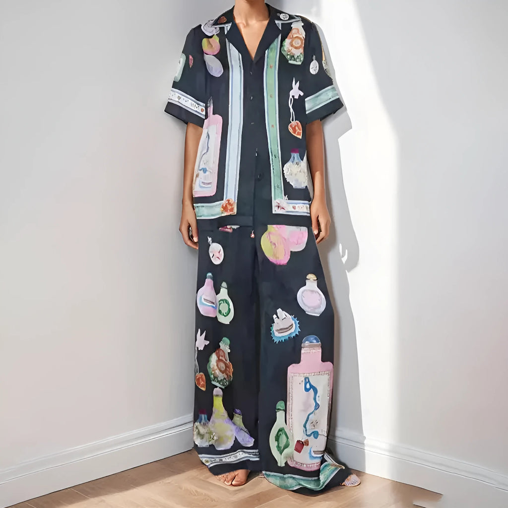 Women's black casual set with cartoon print, featuring a long-sleeve cardigan and matching trousers