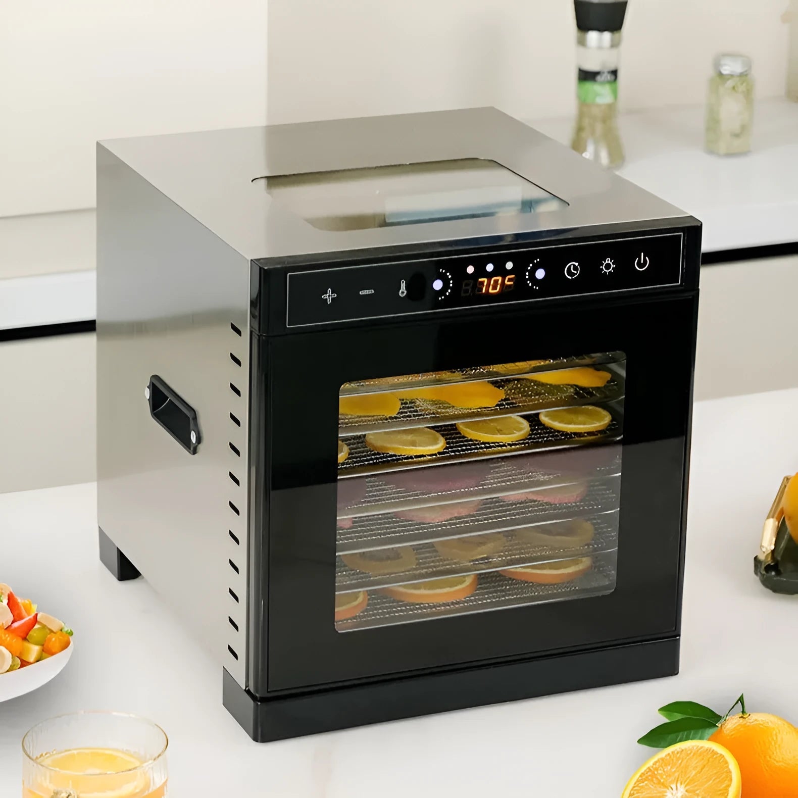 Stainless steel fruit dehydrator with multiple trays and an LED control panel.