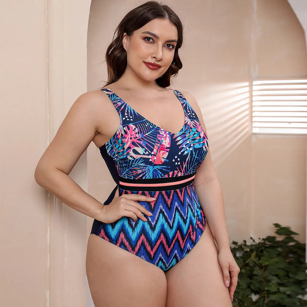 Blue striped one-piece swimsuit with spaghetti straps for women on a mannequin.