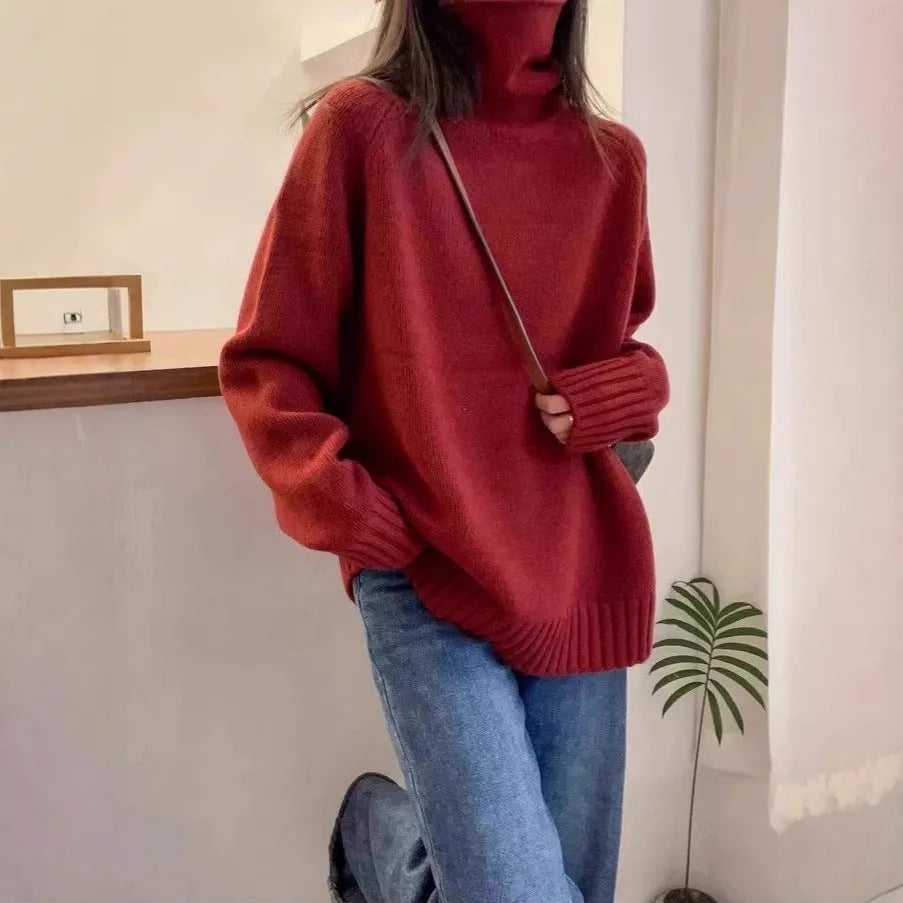 Red loose-fit women's turtleneck sweater with thick knit and a textured curling collar.