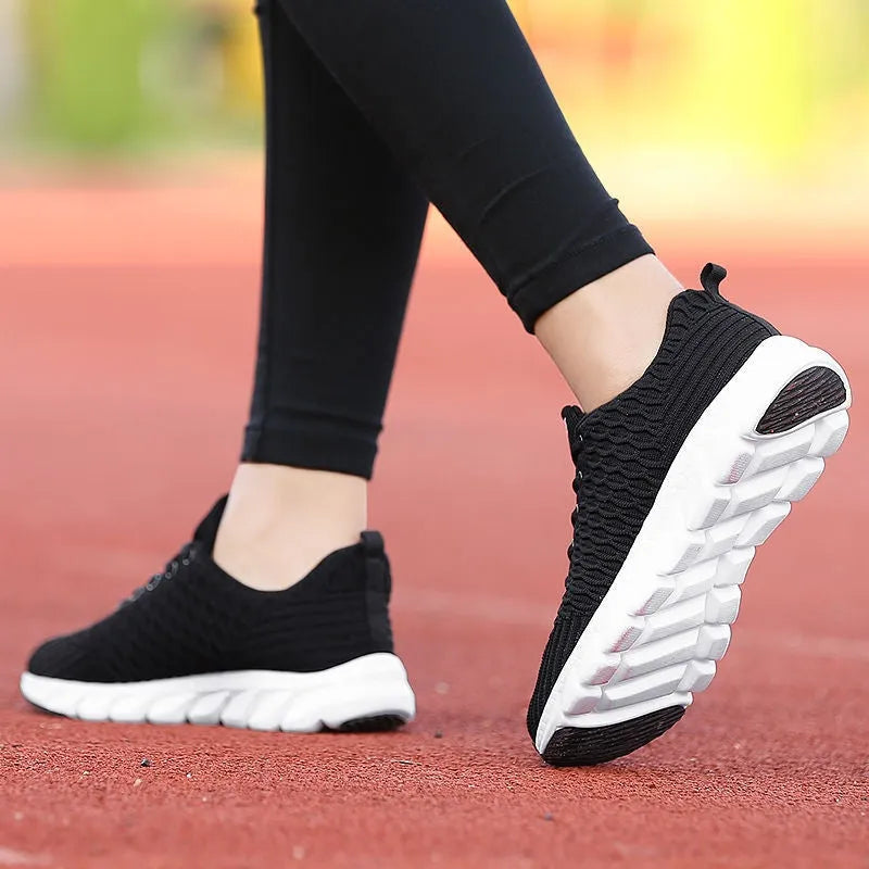 Women's running shoes in black pink white colours with fly weaving upper and wear-resistant outsole