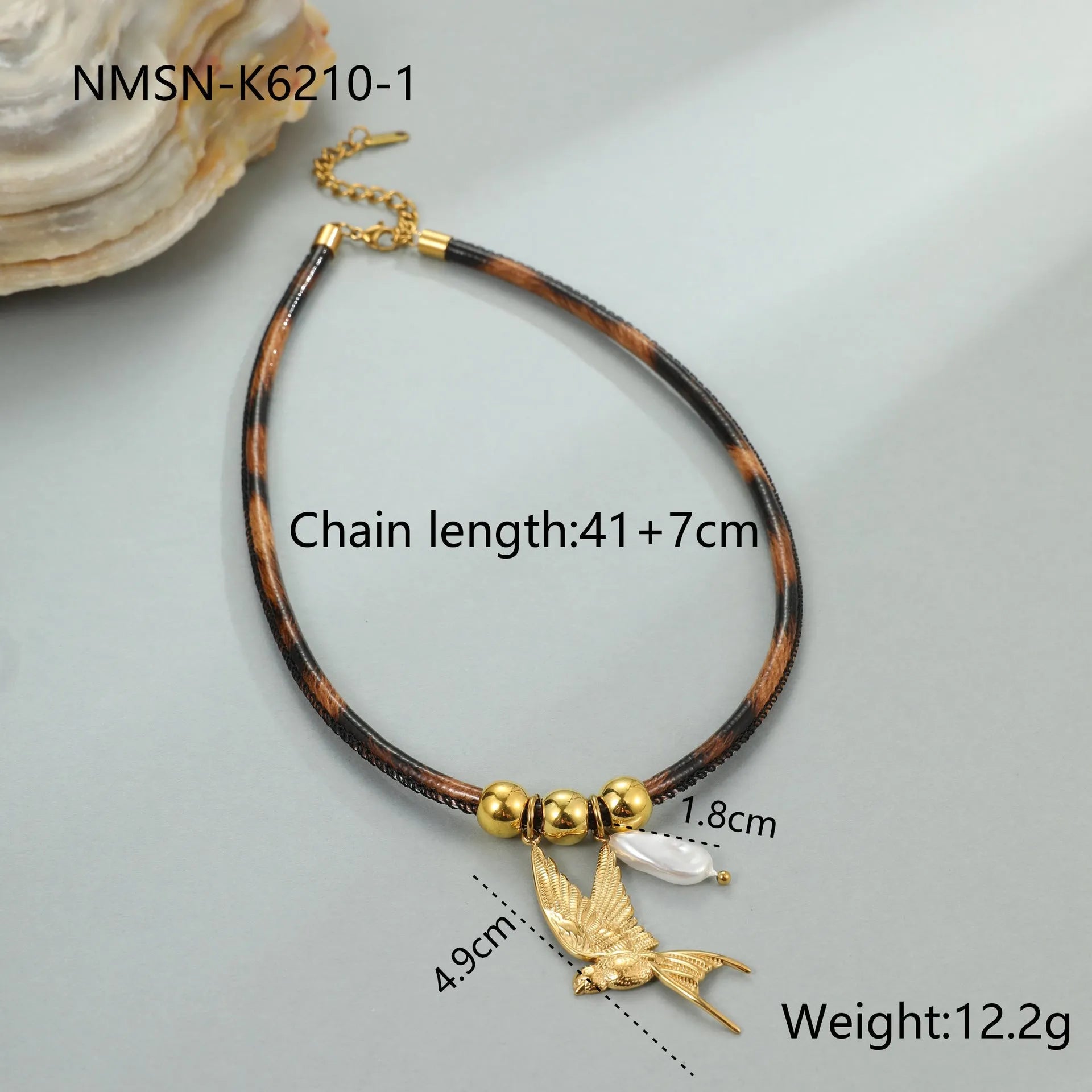 Geometric leopard print pendant on a gold-toned stainless steel necklace for women.