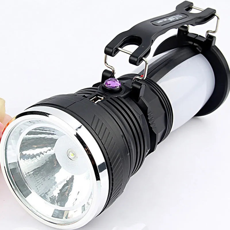 Black solar charging LED emergency flashlight with USB outlet for camping and outdoor use
