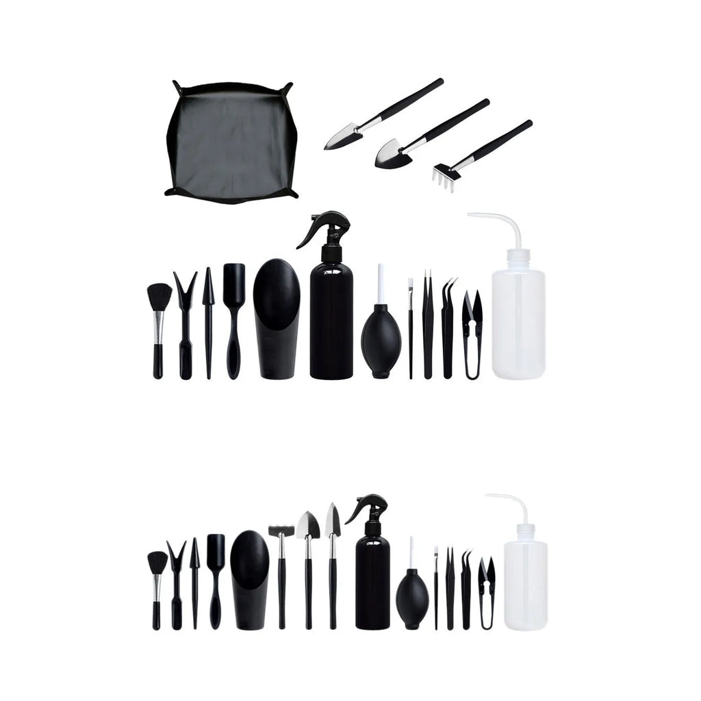 Black plastic and metal mini succulent gardening tool set with 15 pieces laid out on a square cushion.