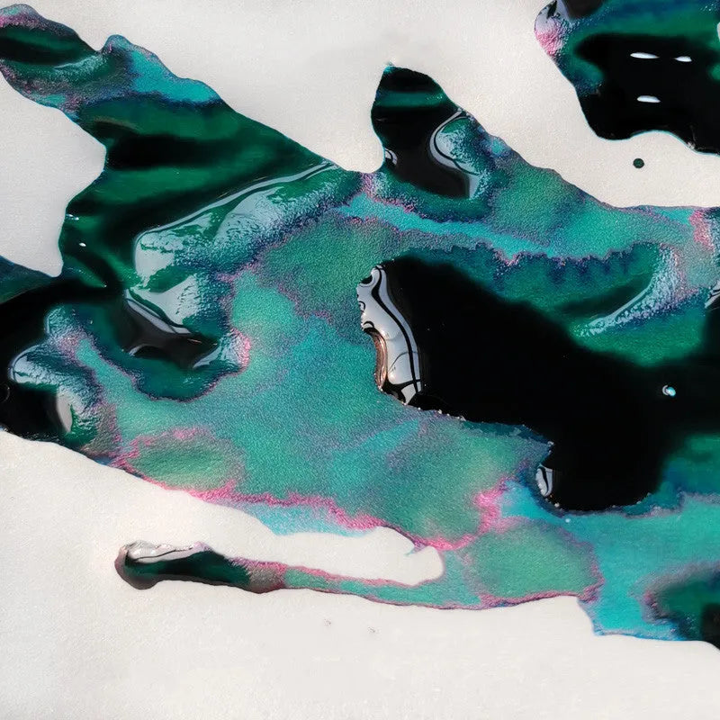 Bottle of gradient sheen ink with gold powder effects for fountain pens and dip pens