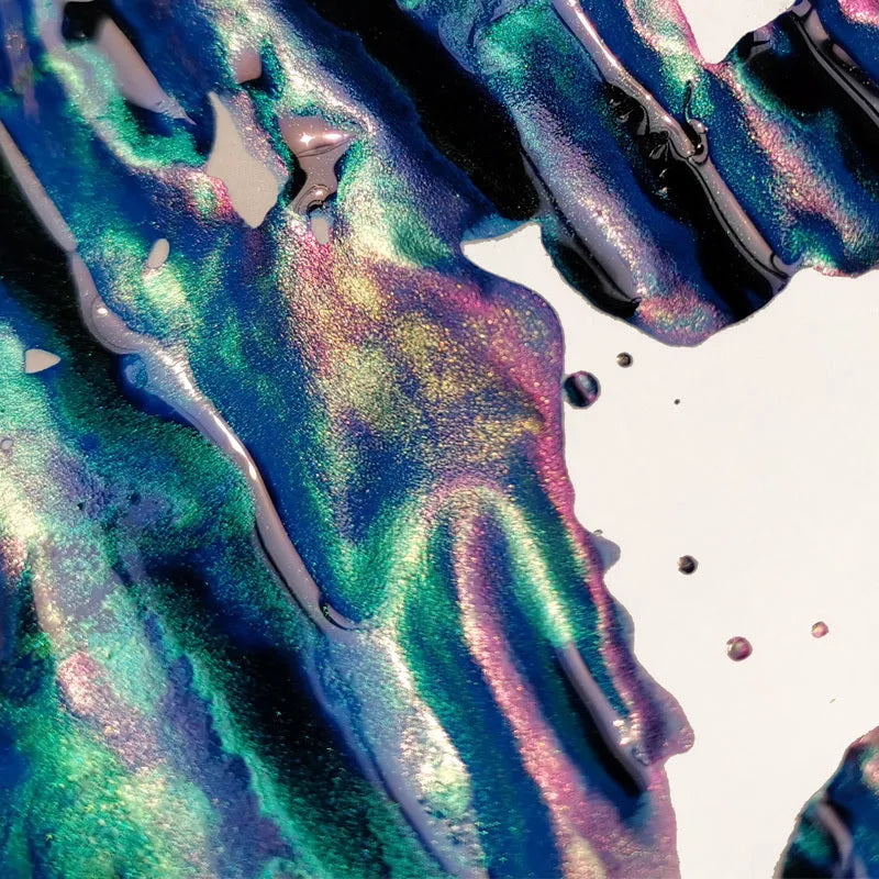 Bottle of gradient sheen ink with gold powder effects for fountain pens and dip pens