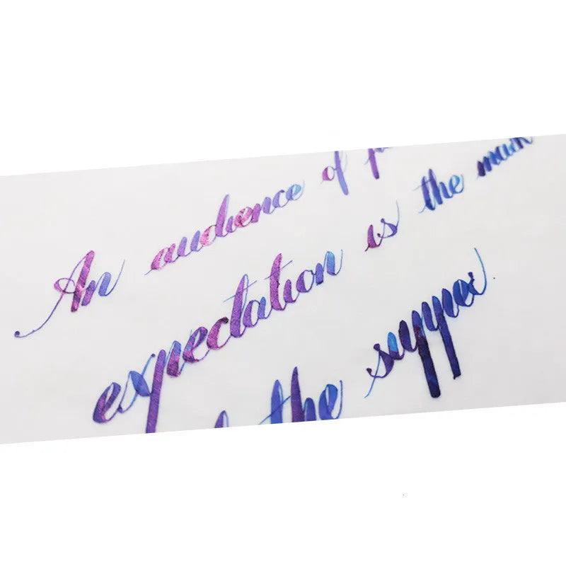 Bottle of gradient sheen ink with gold powder effects for fountain pens and dip pens