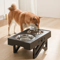 Height-adjustable stainless steel double bowl for dogs with black ABS base and slow feeding design