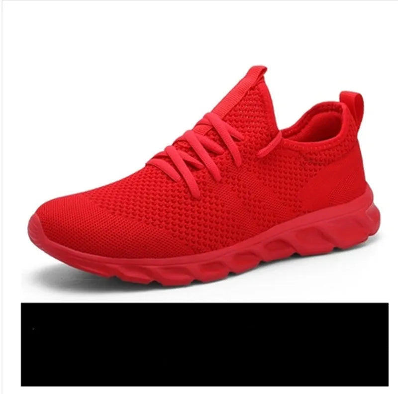 Men's black and white casual sneakers with breathable mesh upper and lace-up closure on a PVC sole.