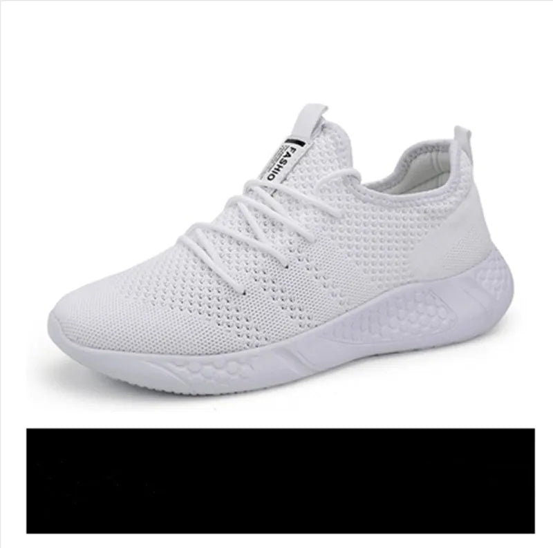 Men's black and white casual sneakers with breathable mesh upper and lace-up closure on a PVC sole.
