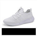 Men's black and white casual sneakers with breathable mesh upper and lace-up closure on a PVC sole.