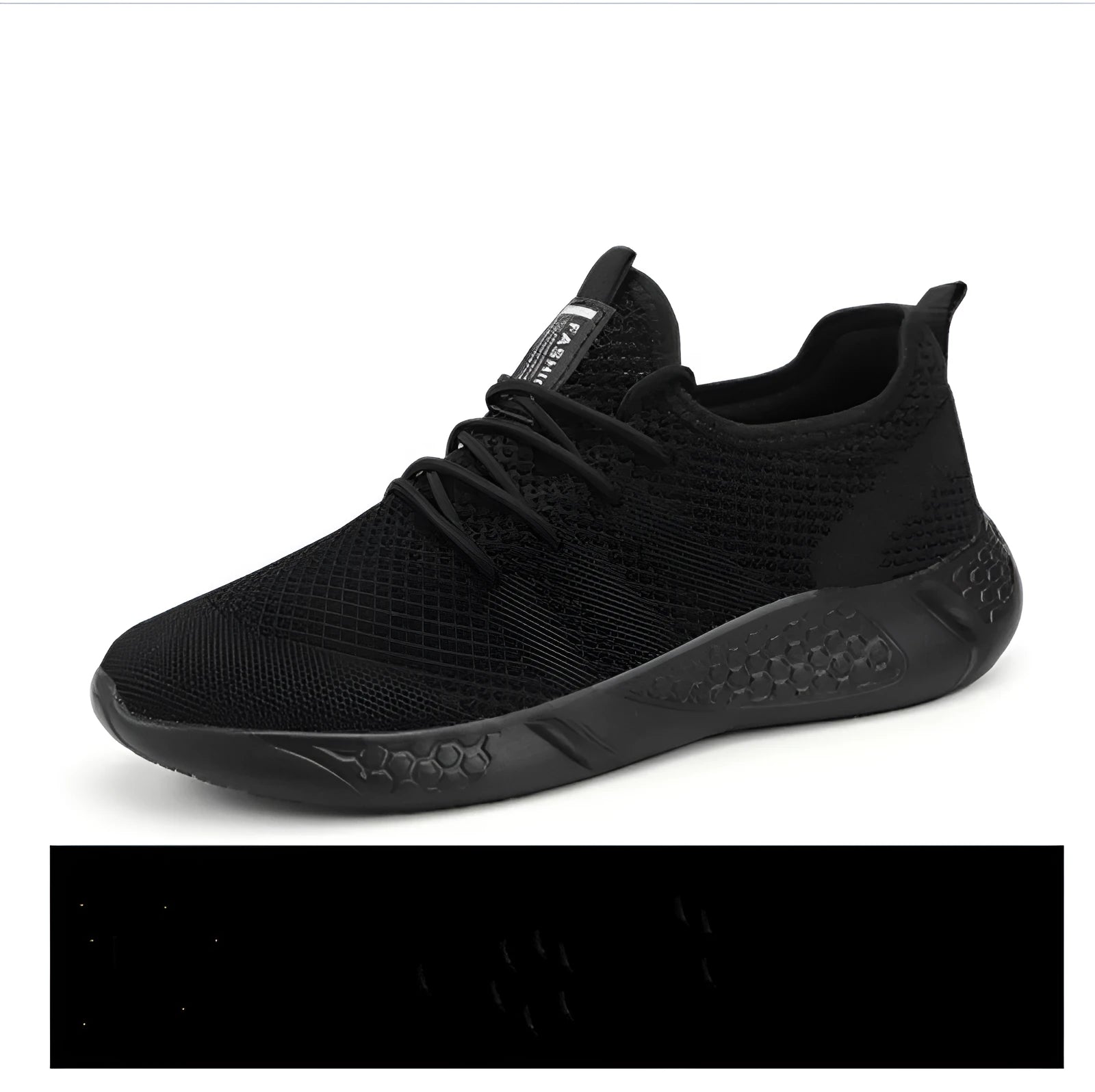 Men's black and white casual sneakers with breathable mesh upper and lace-up closure on a PVC sole.