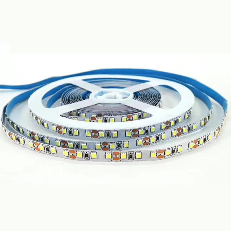 Close-up of a flexible 12V LED soft light strip with closely spaced white LEDs, showing solder connection patches.