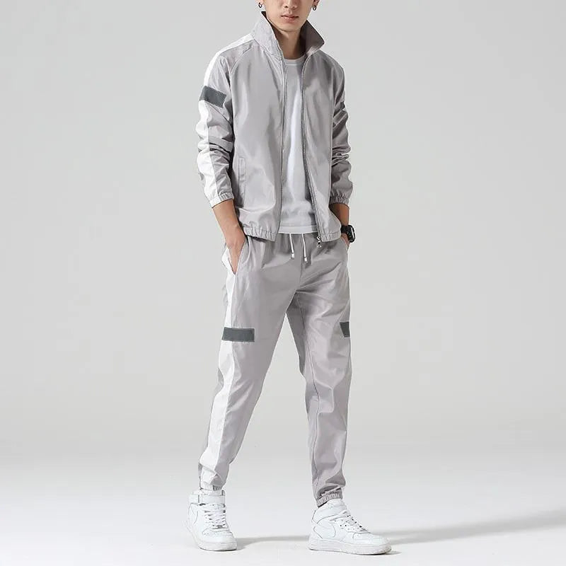 Men's polyester sportswear suit with stand collar jacket and loose fit trousers in black