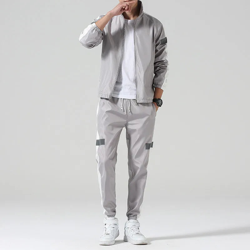 Men's polyester sportswear suit with stand collar jacket and loose fit trousers in black