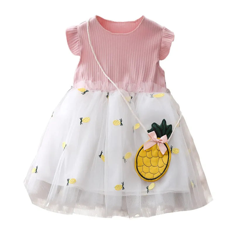 Girls summer cotton knit net yarn dress in yellow with optional coin purse, side view on child