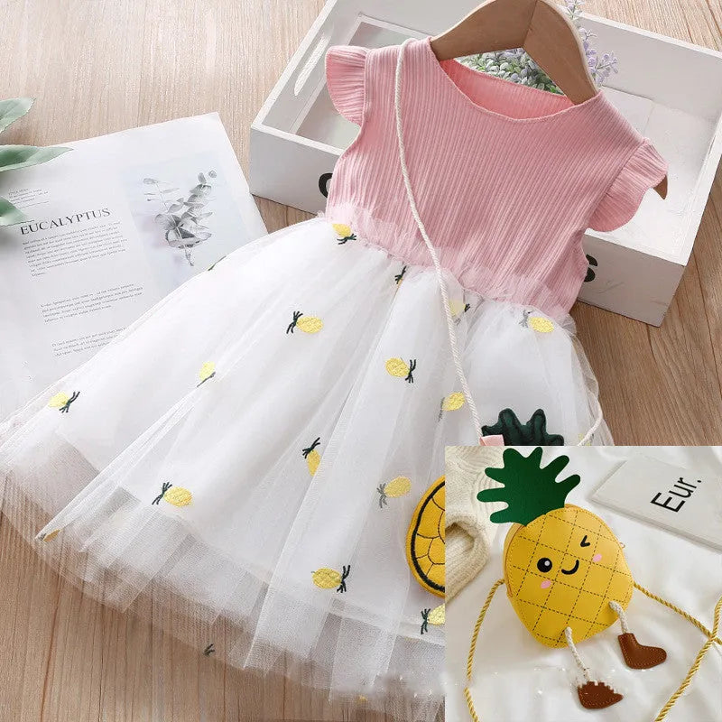 Girls summer cotton knit net yarn dress in yellow with optional coin purse, side view on child