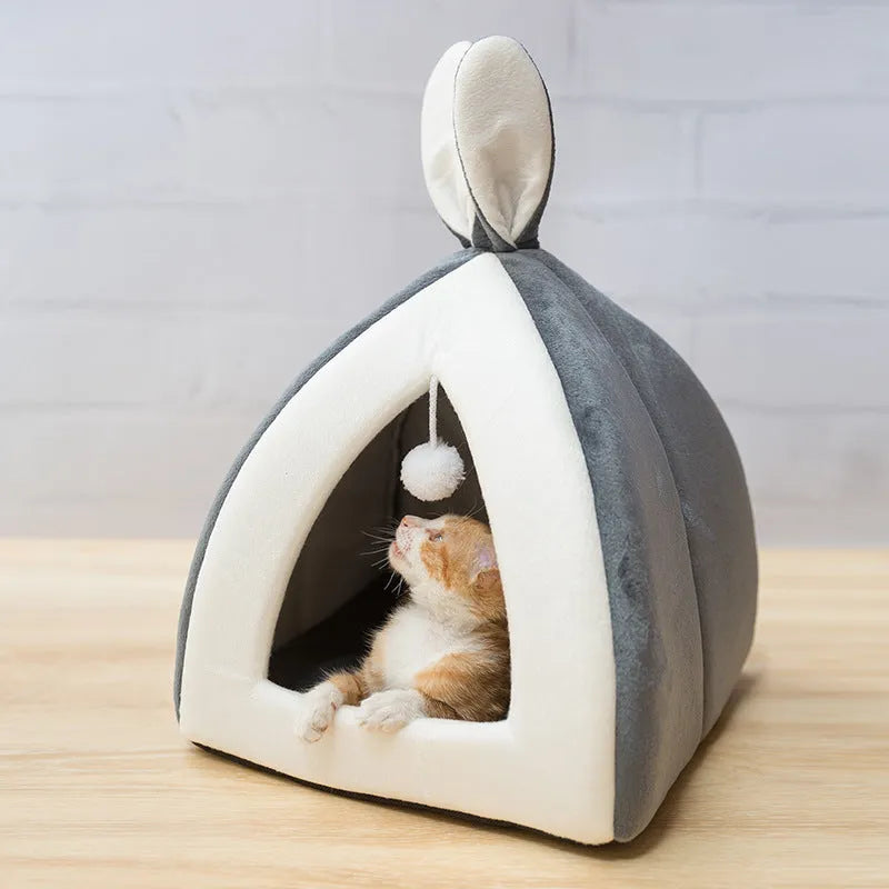 Grey cloth cat house villa pet bed with tunnel entrance, shown next to a small dog for scale
