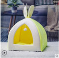 Grey cloth cat house villa pet bed with tunnel entrance, shown next to a small dog for scale