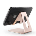Metal desktop phone holder in black with adjustable arm compatible with Apple iPhone charging