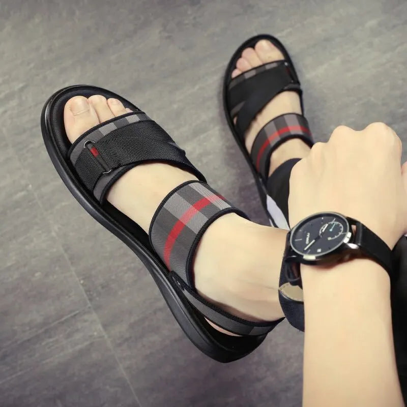 A pair of youth leisure sports sandals with a light blue Lycra upper and a polyurethane sole.